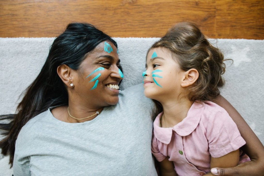 A mother and daughter with matching face paint